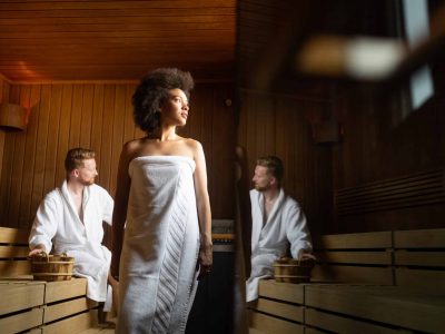 Couple resting, relaxing and sweating in sauna